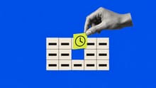 A hand lifting a clock-marked card from a packed calendar to make time for improving work