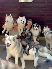 Steven with a pack of huskies